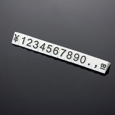 140 pcs Triangular price cubes are made from white plastic and have embossed black lettering